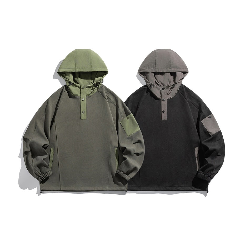 Two hooded pullovers shown from the front: one dark gray with olive accents and one black with gray accents.