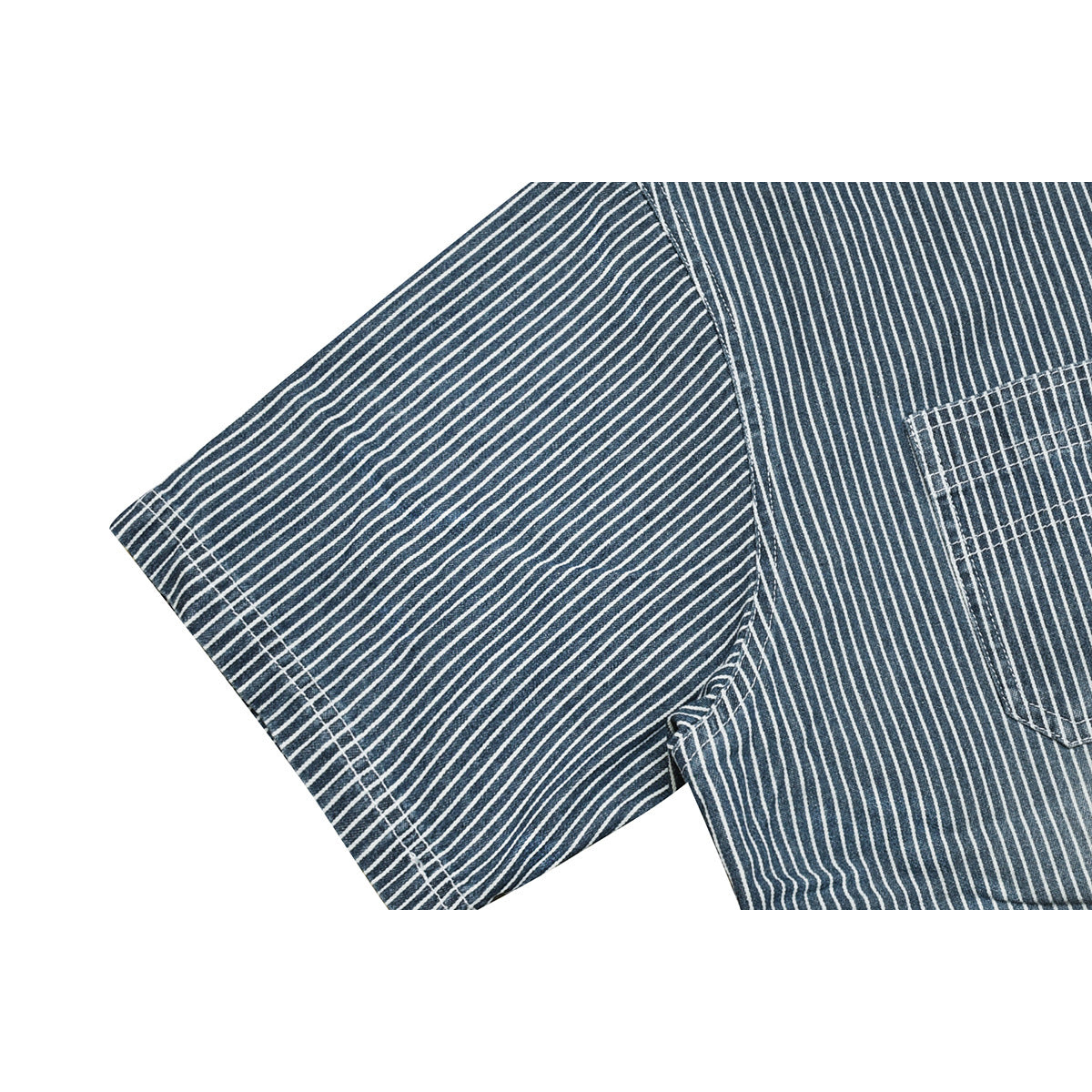 Close-up of the short sleeve and chest area of a dark blue shirt with narrow white pinstripes.