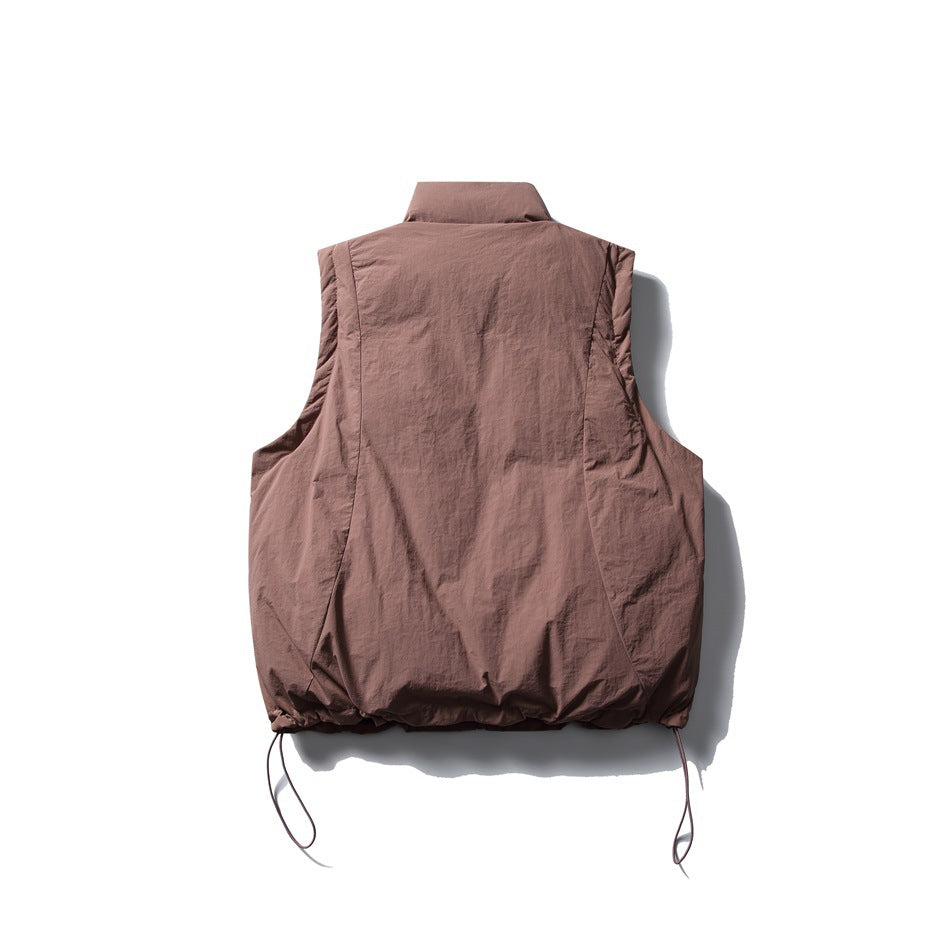 Back view of a dusty mauve sleeveless vest with a high collar, panel seams, gathered hem, and drawcords.