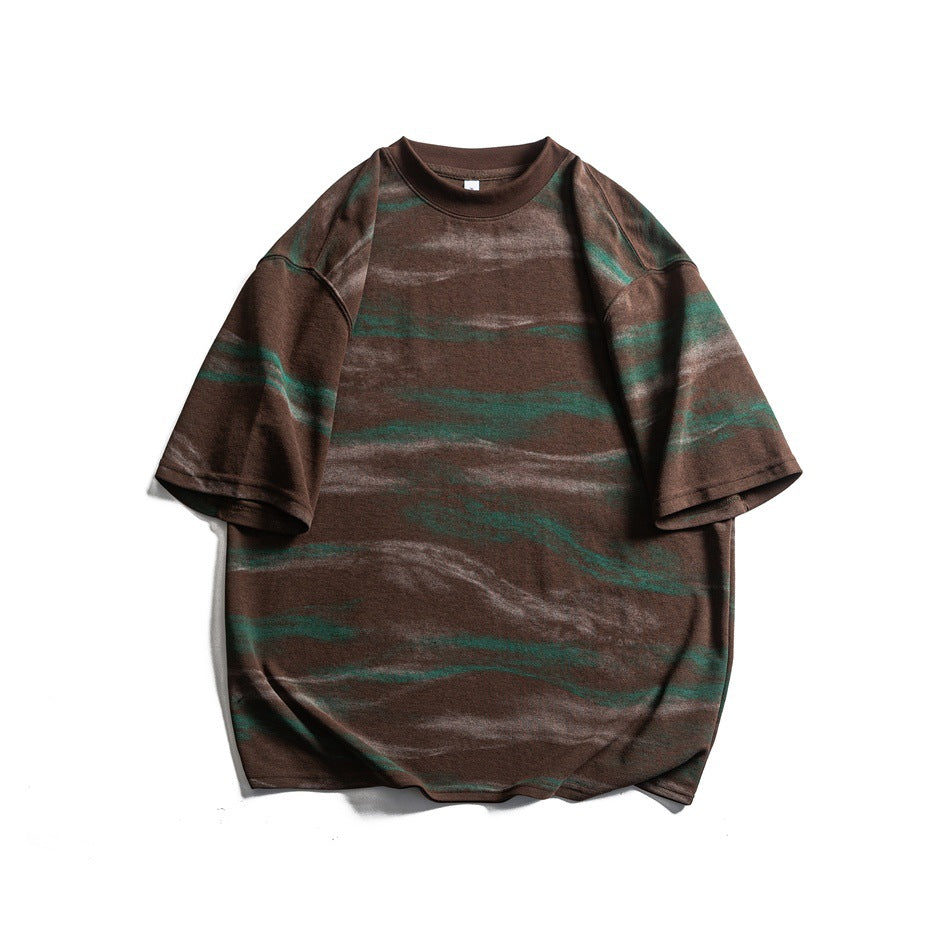 Brown short-sleeve crew neck T-shirt with green and light horizontal brushstroke pattern, flat lay front view