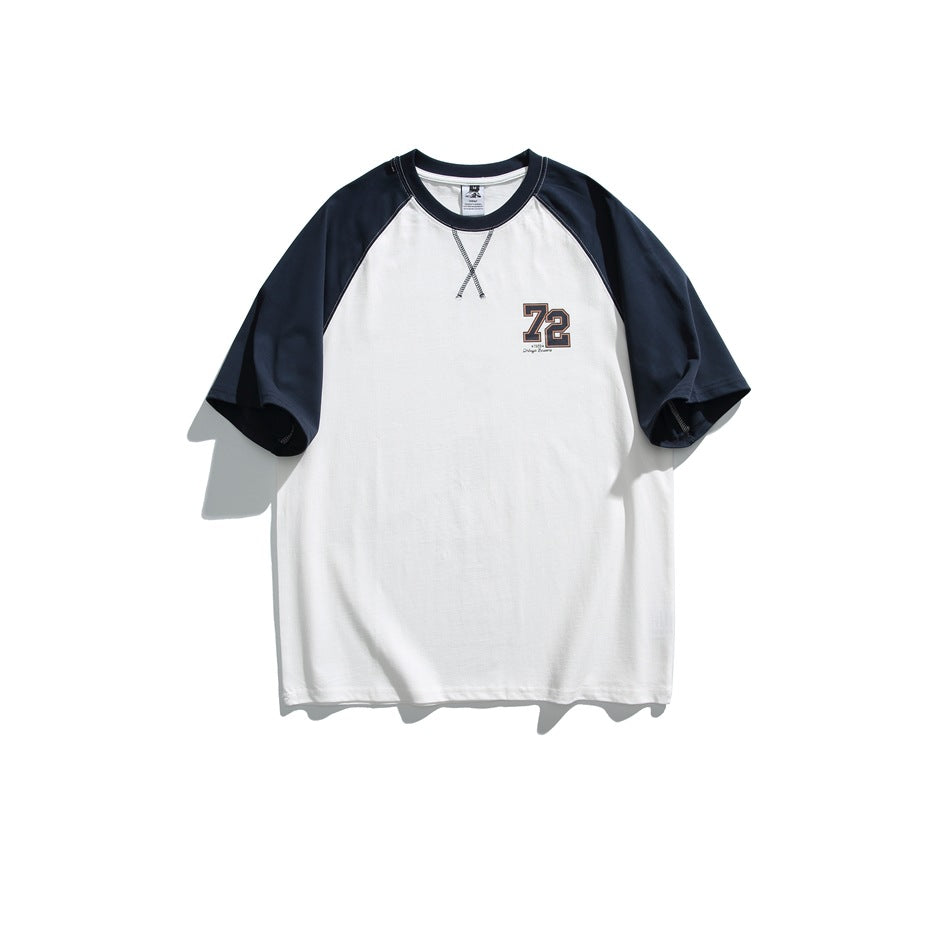 White short-sleeve raglan T-shirt with navy sleeves and collar and a small 72 chest print, flat front view