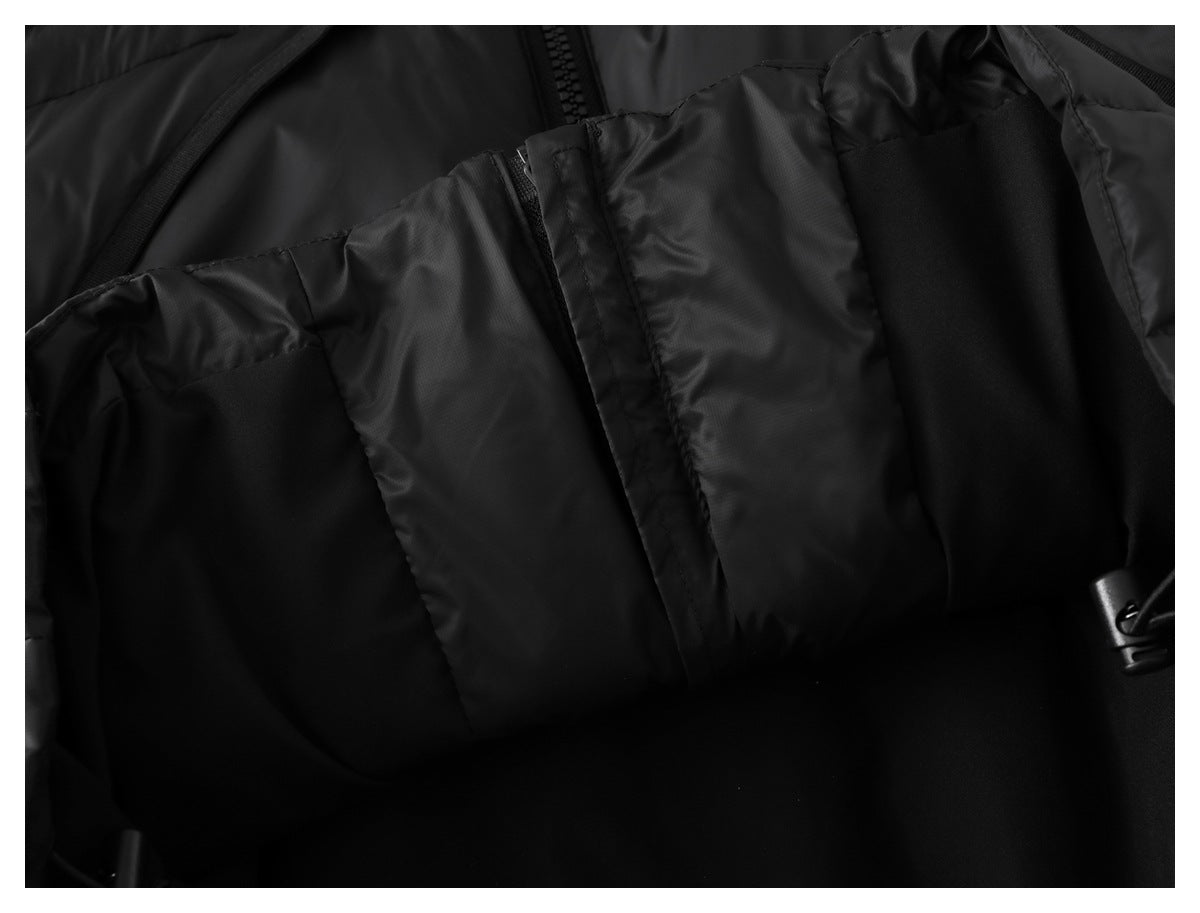 Close-up of the black jacket's inner lining and a fabric panel with a small fastening detail.