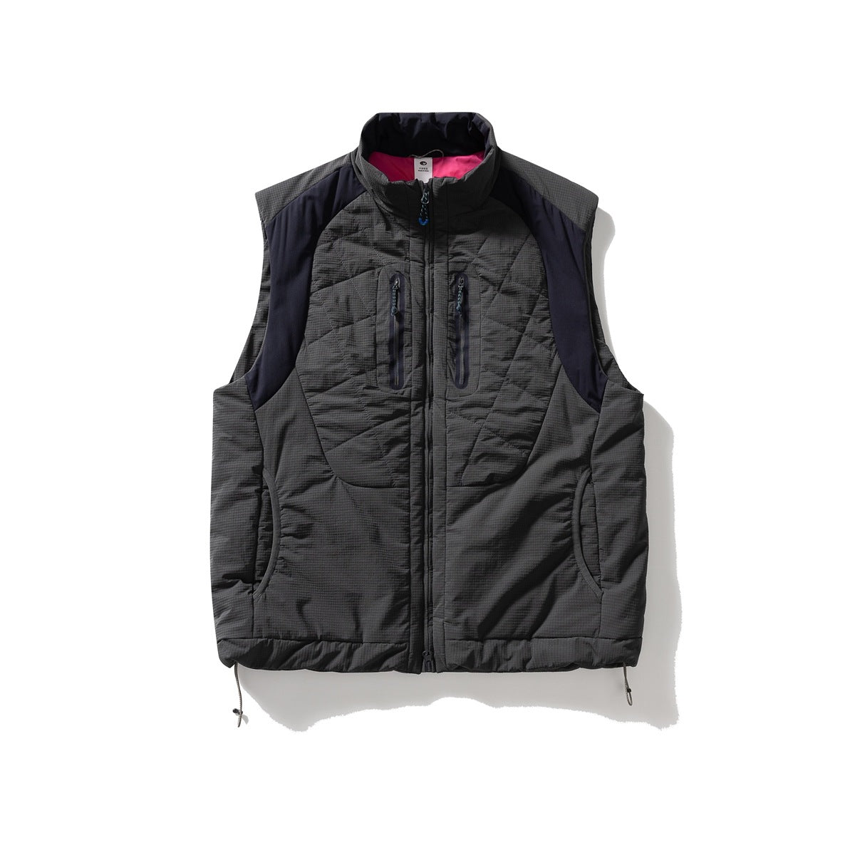 Dark gray quilted sleeveless vest with navy shoulder panels, zip chest pockets and pink collar interior