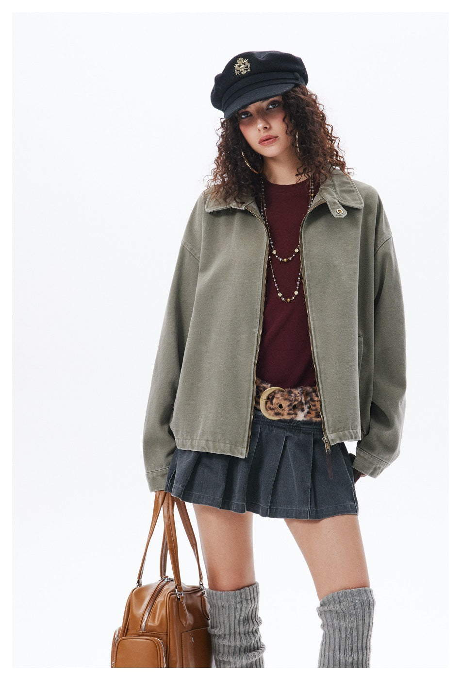Front view of a model wearing an oversized olive-gray collared jacket with a front zipper.