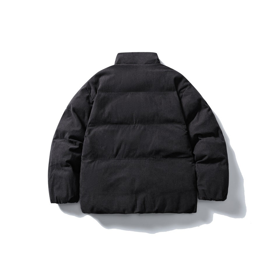 Back view of dark gray quilted stand-collar jacket with horizontal quilting and a textured surface