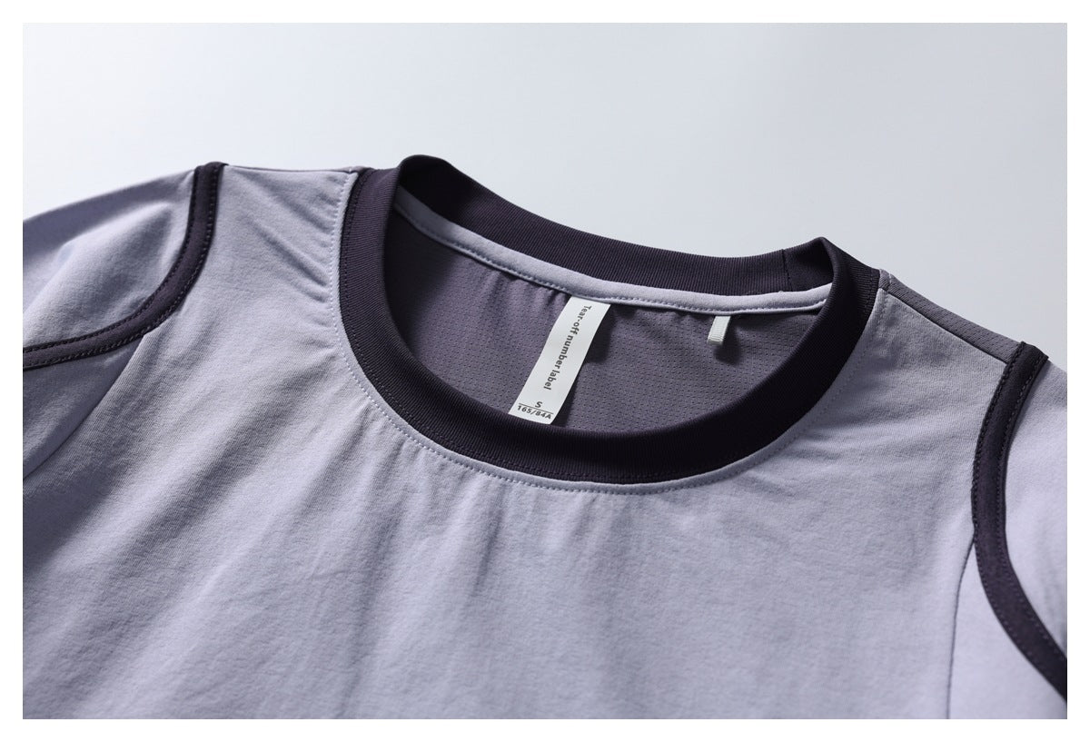 Close-up of a light gray shirt neckline with a dark ribbed collar and an inner label.