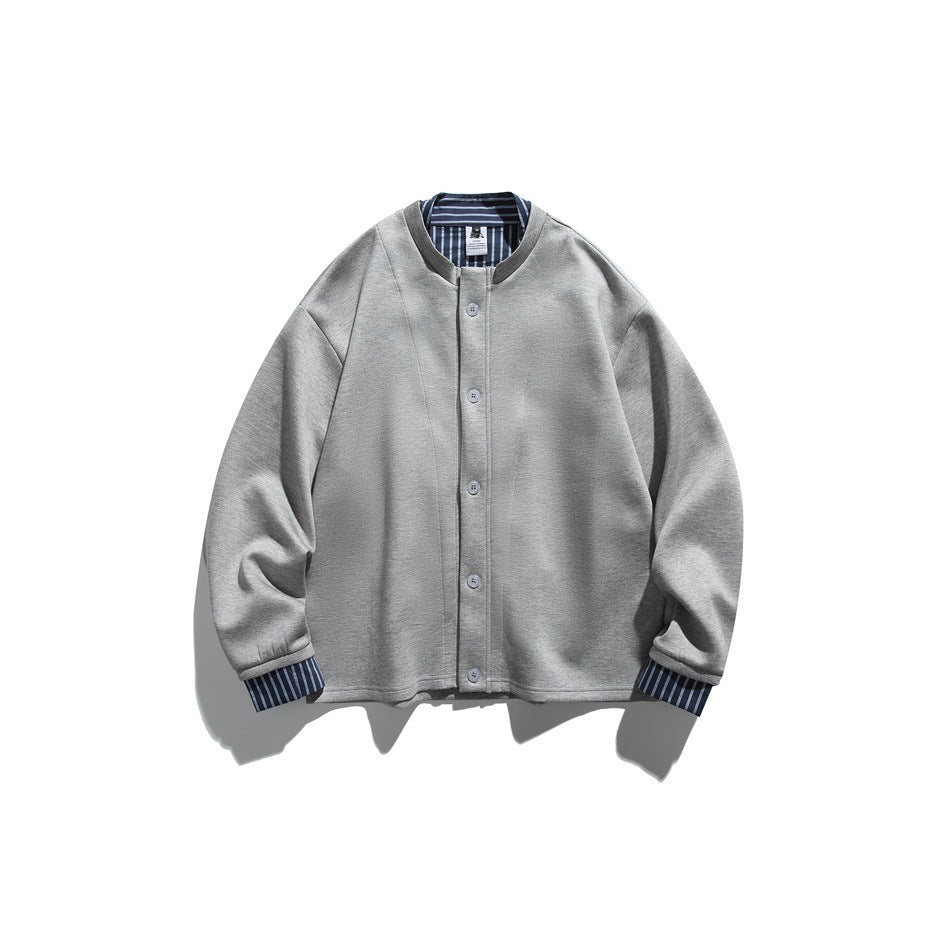 Front view of a light gray button-front jacket with a dark collar and striped inner collar and cuffs.