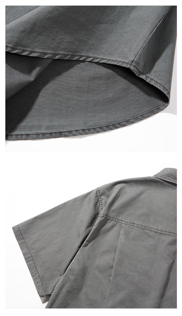 Close-up views of the charcoal gray shirt's curved hem and short sleeve with back shoulder seam.