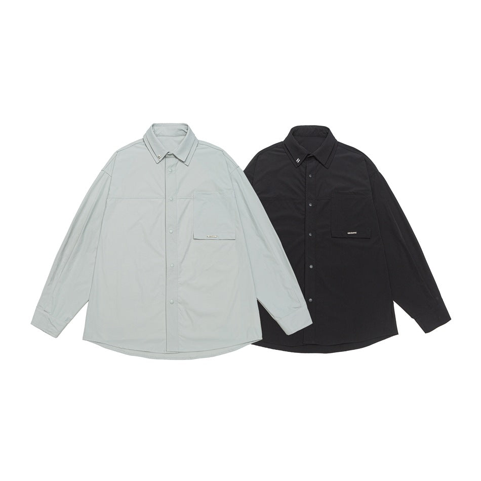Two flat-lay button-front shirts shown together in light gray and black, each with a chest pocket.