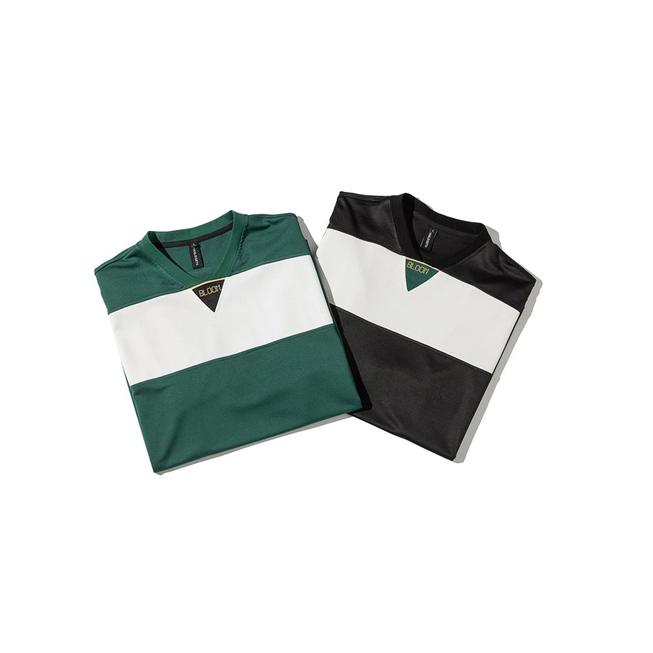 Two folded V-neck color-block T-shirts in dark green and black, each with a broad white chest stripe.