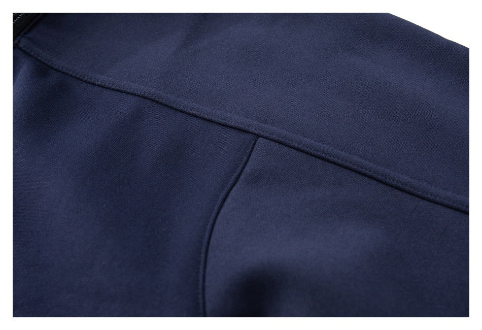 Close-up of a stitched seam across the navy pullover's back shoulder area.