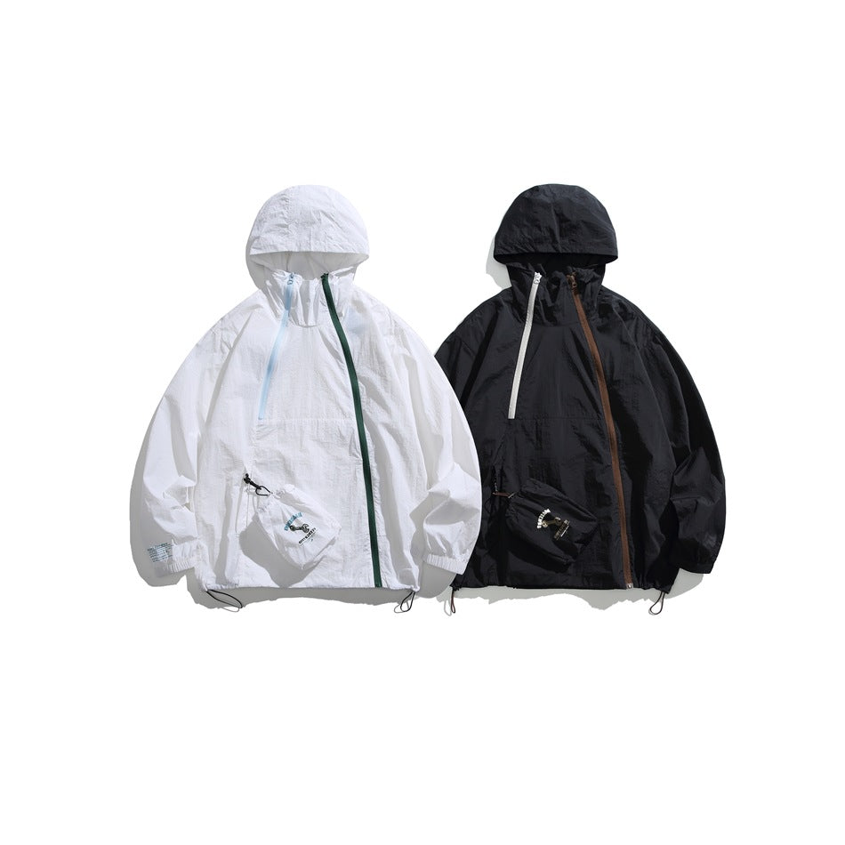 Two hooded pullover jackets displayed side by side: one white with contrasting zips and one black with contrasting zips.
