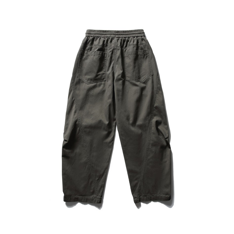 Army green wide-leg pants back view with two patch back pockets and curved leg seams