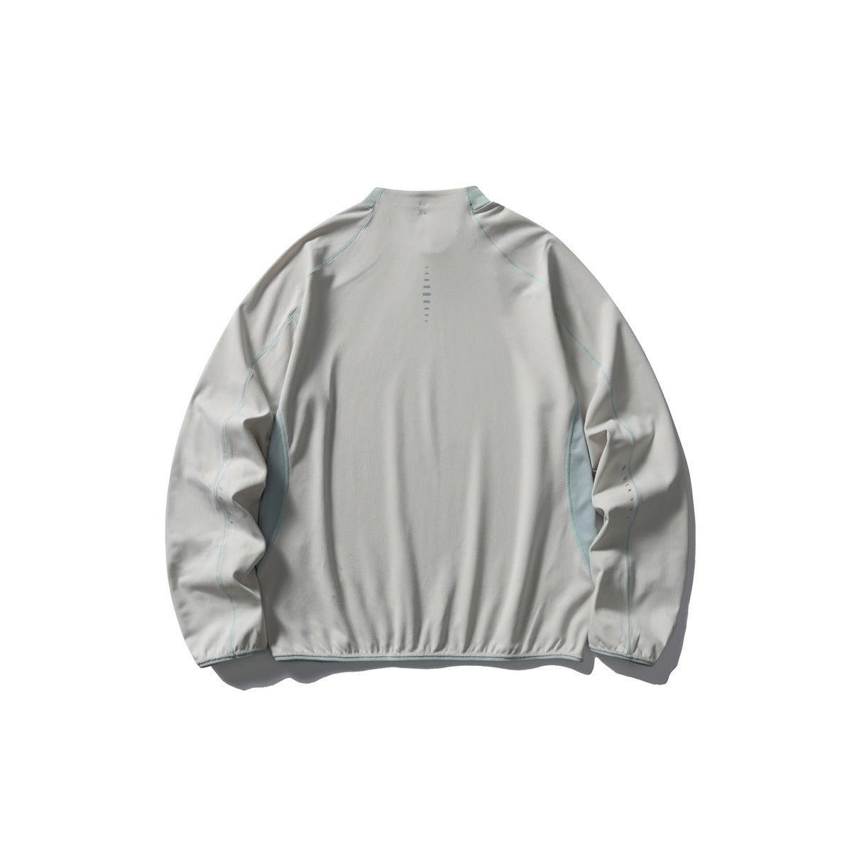 Back view of a pale gray long-sleeve pullover with a high collar, pale blue piping and side panels.