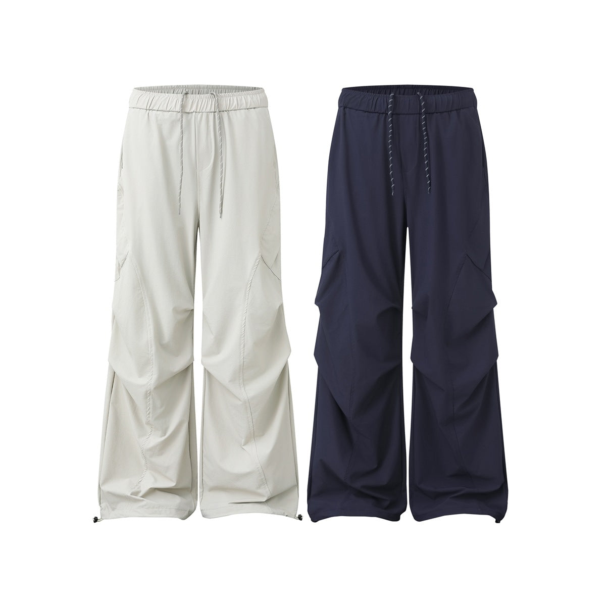 Front view of wide-leg drawstring pants in light gray and navy, with elastic waists and angled panel seams.