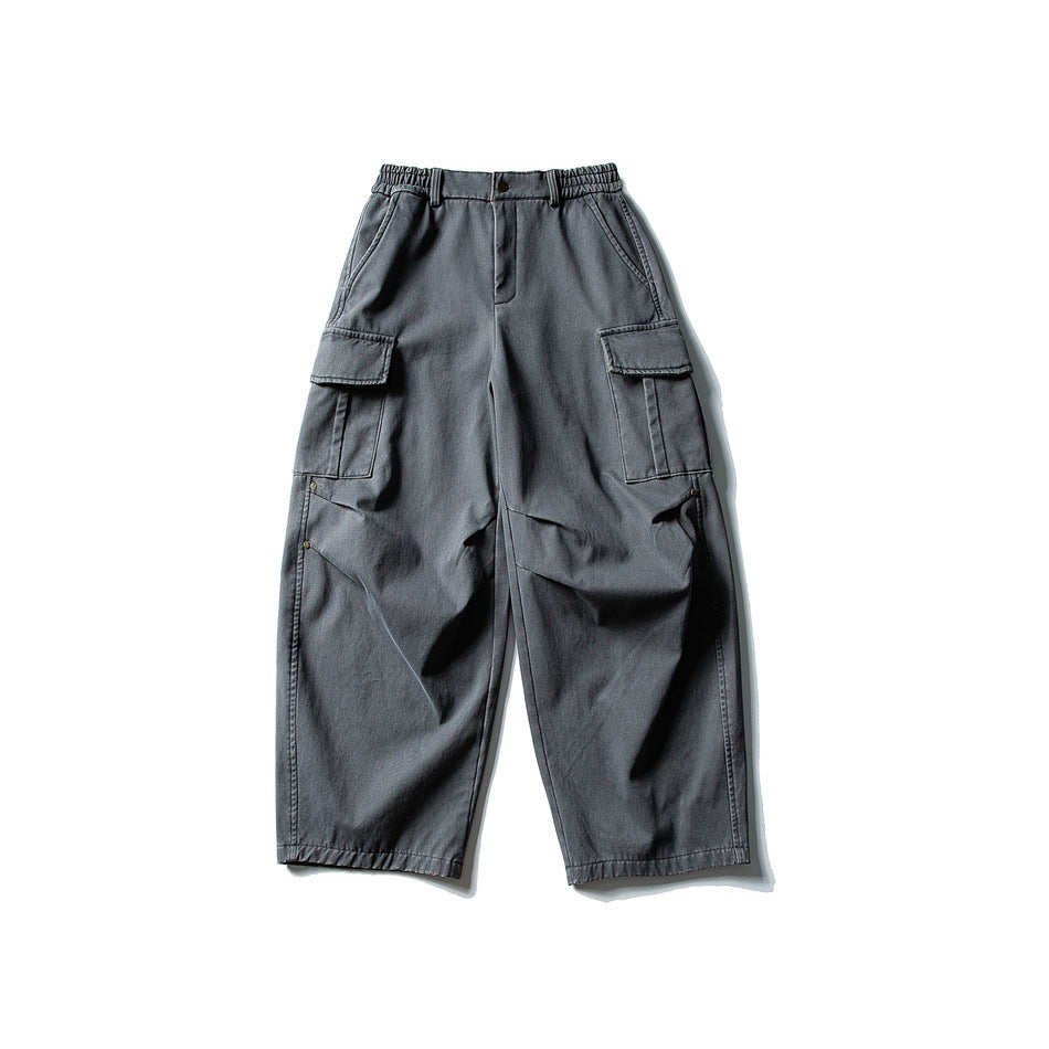 Gray wide-leg cargo pants flat lay, front view, with elastic waist, button closure and large flap side pockets
