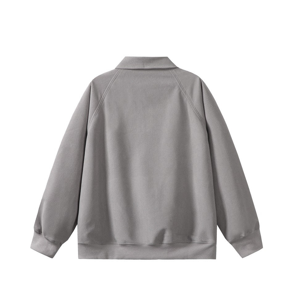 Back view of a gray long-sleeve pullover with a collar, raglan seams, and ribbed cuffs and hem.