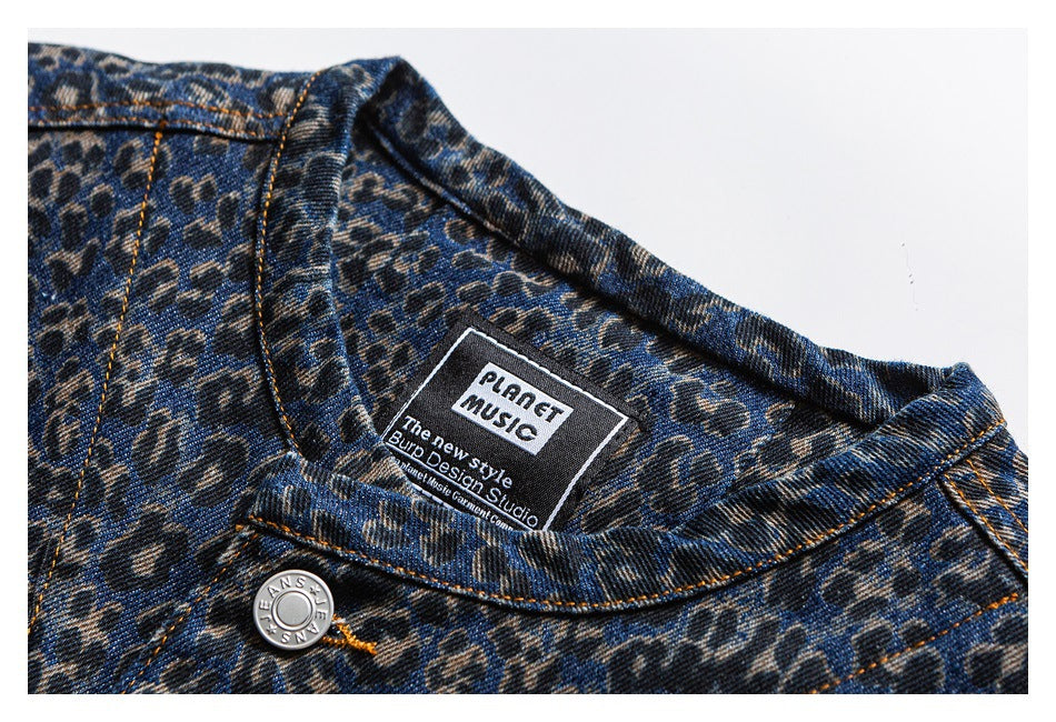 Close-up of the patterned denim jacket collar and inside neck label reading “PLANET MUSIC.”