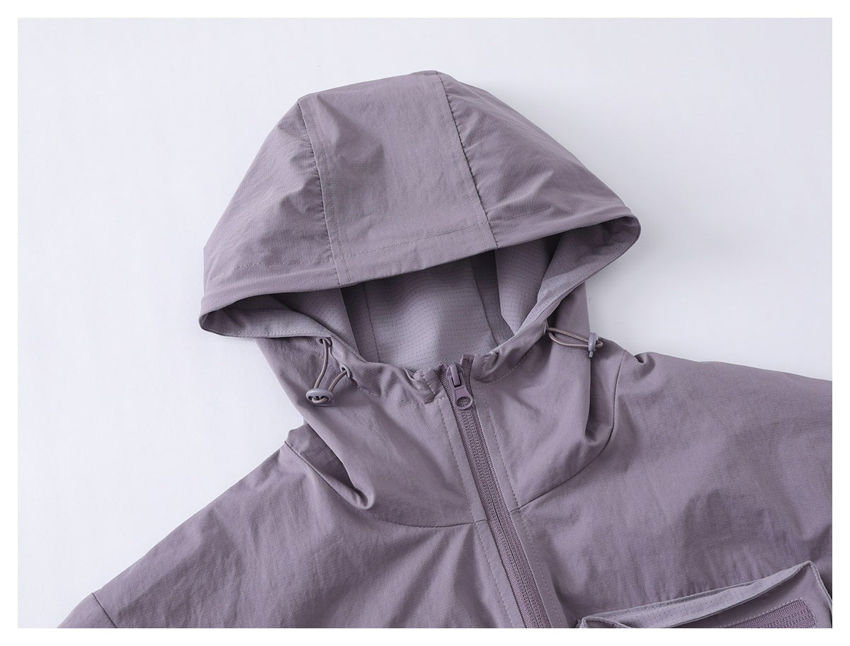 Close-up of a muted lavender-gray jacket hood with drawcords, lining, and front zipper.