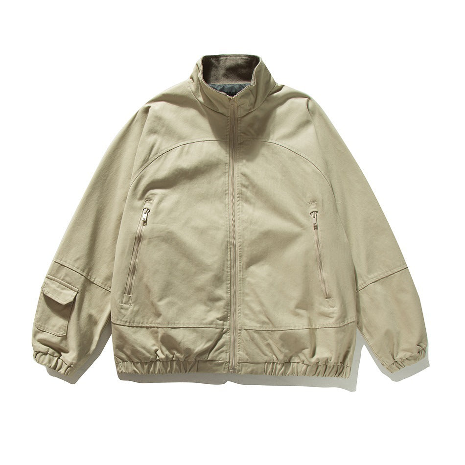 Beige stand-collar zip jacket flat lay with zippered chest pockets, sleeve flap pocket and elastic cuffs and hem