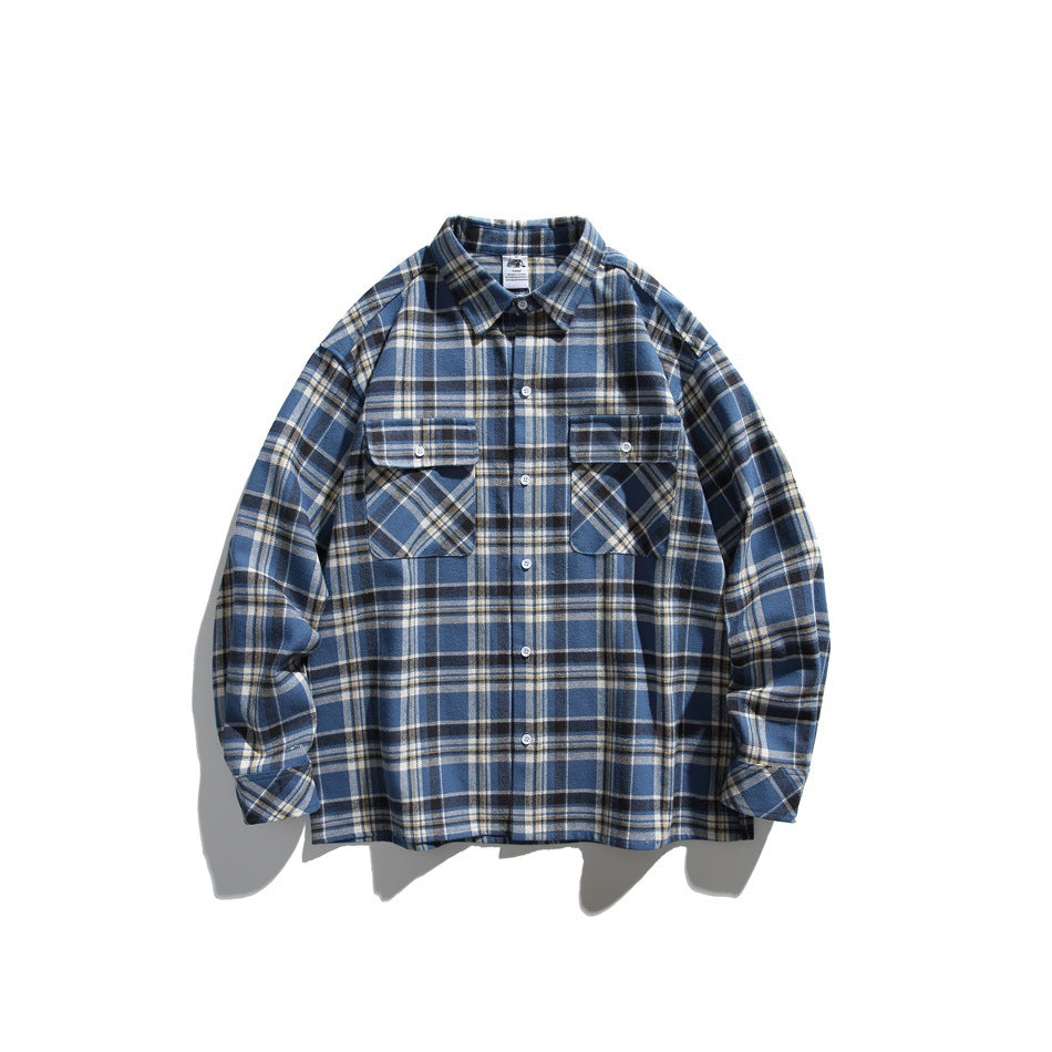 Blue plaid long-sleeve button-front shirt flat lay with two chest flap pockets and pointed collar