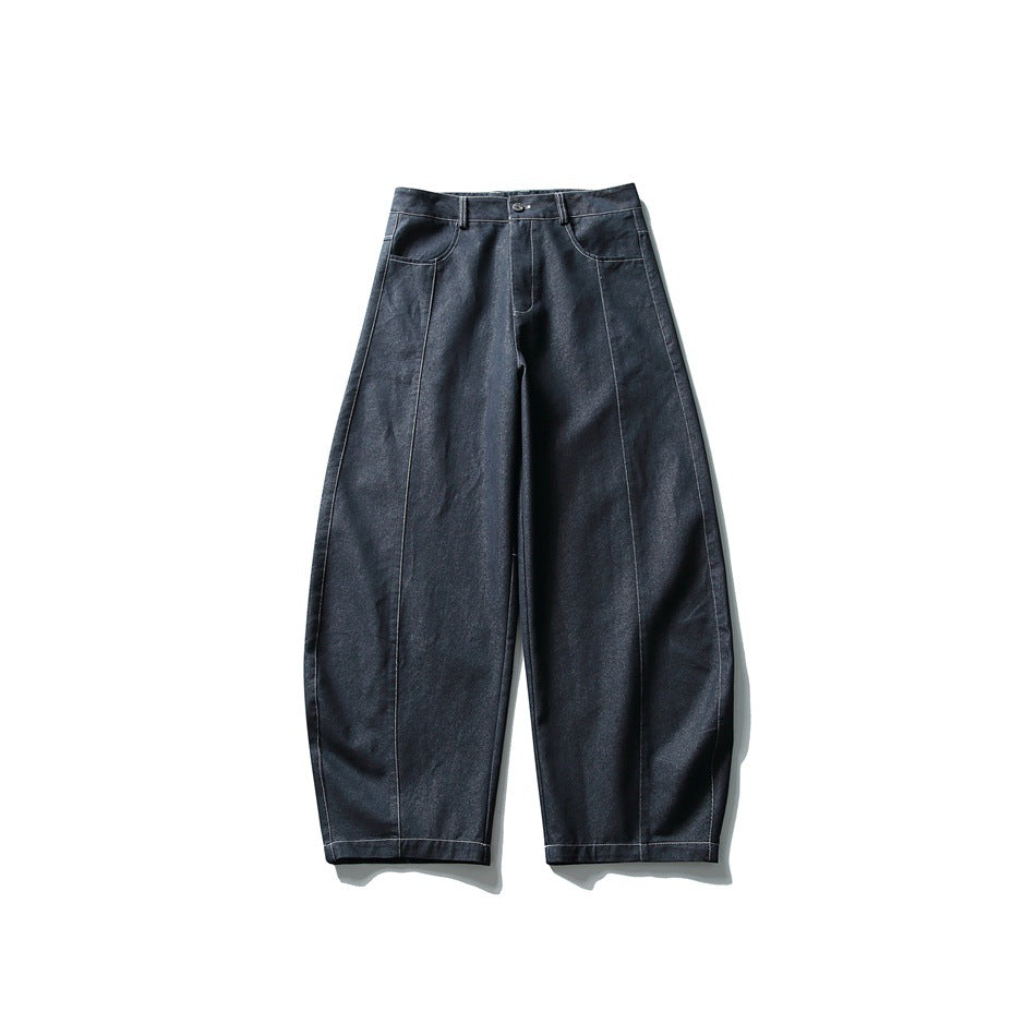 Front view of navy wide-leg jeans with a curved leg, contrast stitching, button fly and front pockets