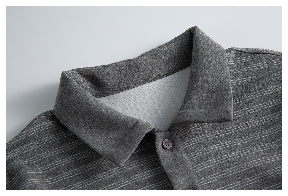 Close-up of a dark gray striped polo shirt collar and button placket.