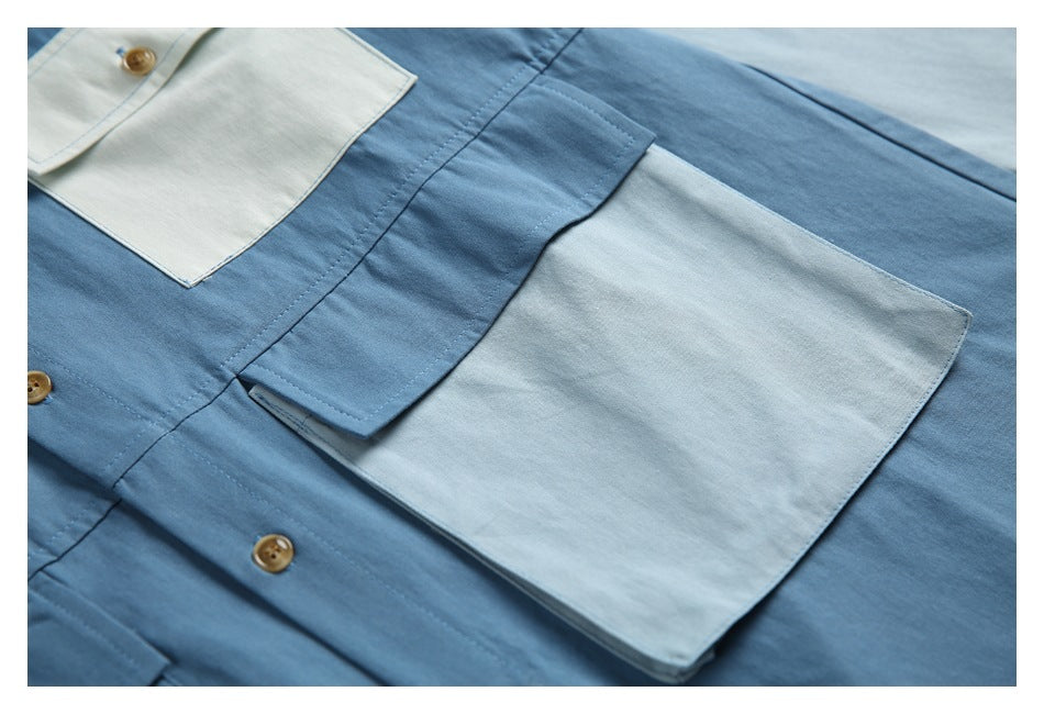 Close-up of a pale patch pocket and overlapping blue panel on the shirt front.