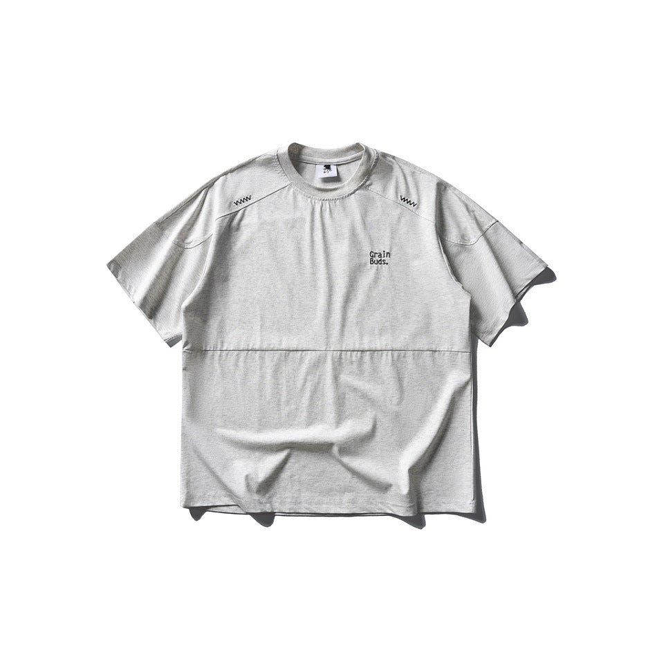 Heather gray short-sleeve crew-neck T-shirt flat lay with shoulder zigzag stitching and small chest embroidery