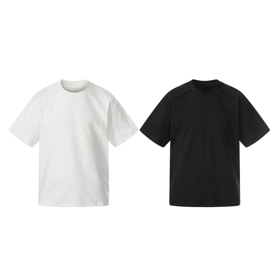 Two plain short-sleeve crew-neck T-shirts shown side by side, one white and one black, front view.