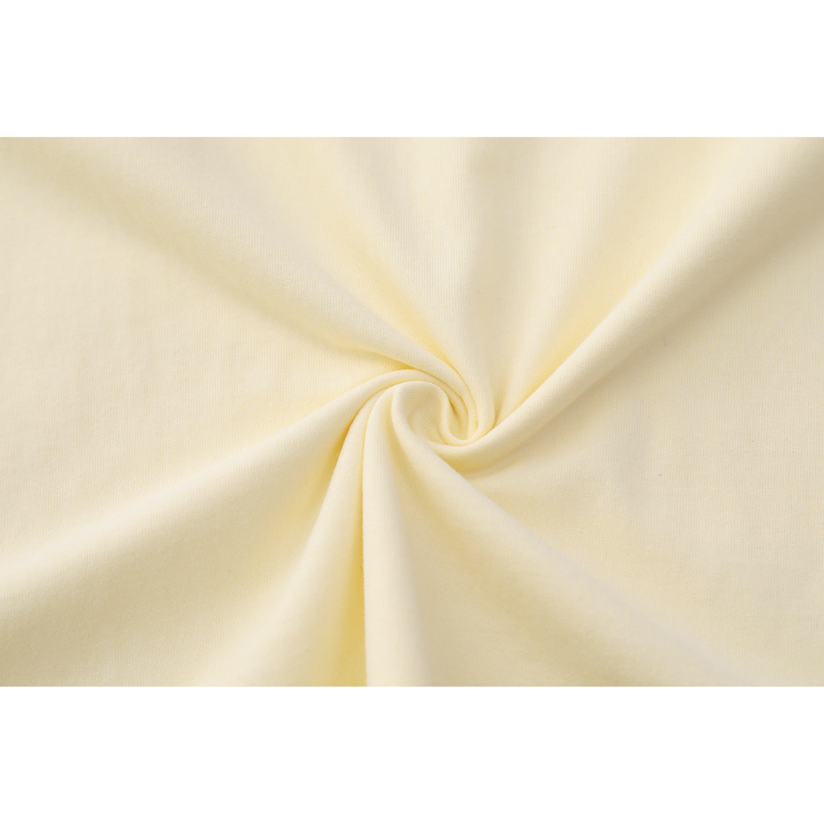 Close-up of cream-colored fabric gathered into soft folds.