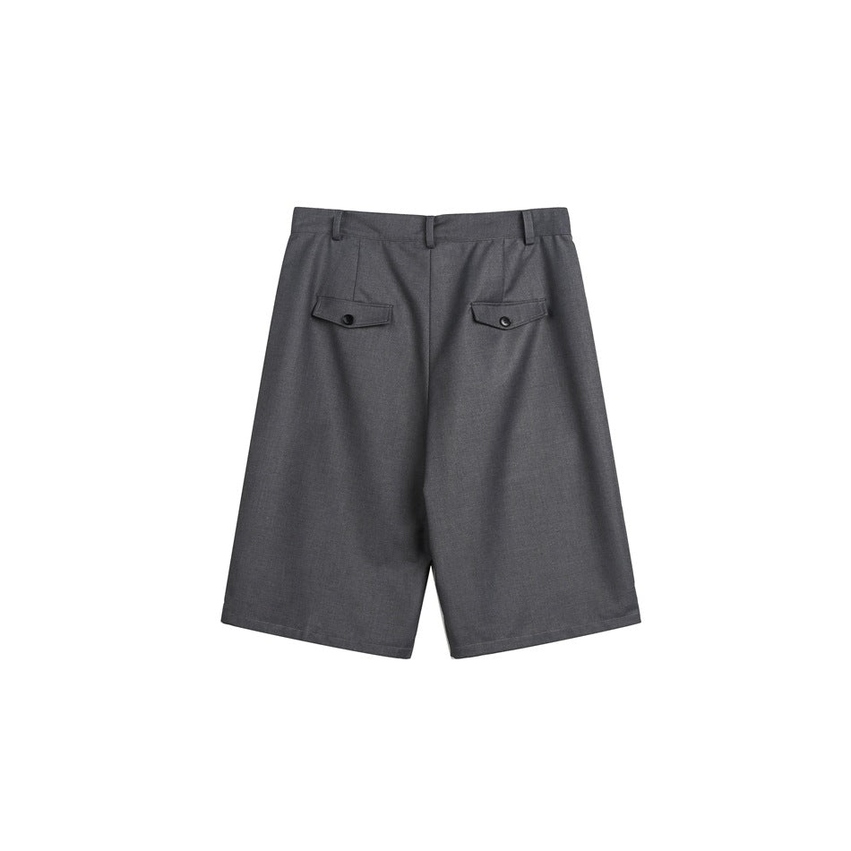 Back view of charcoal gray tailored shorts with belt loops and two buttoned flap pockets.