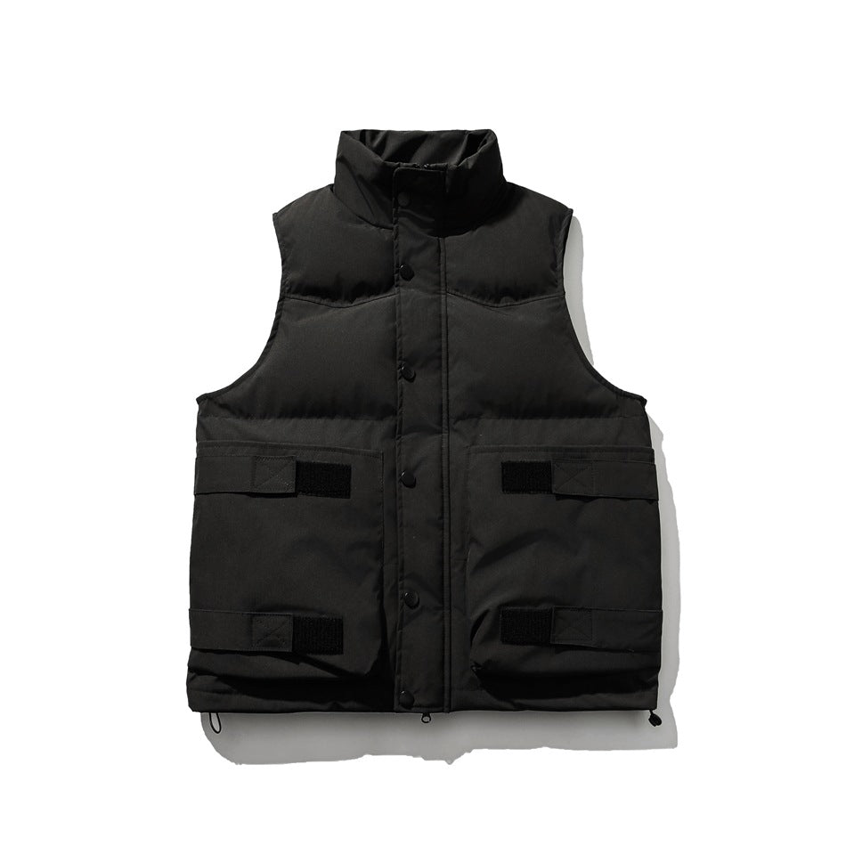 Black quilted puffer vest with stand collar, snap placket and four front flap pockets with straps, flat lay front view