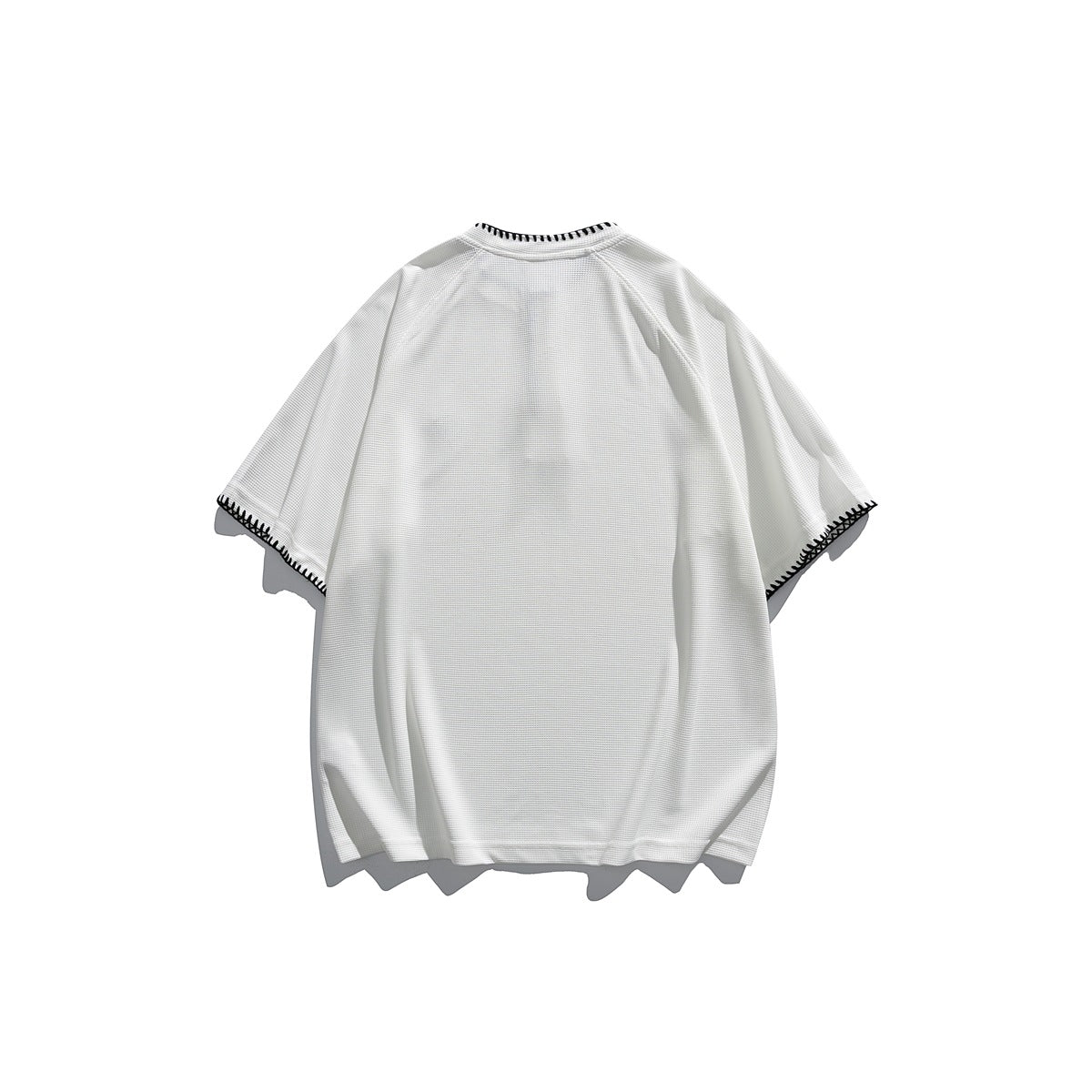 Back view of a white short-sleeve shirt with dark contrast stitching around the collar and sleeve hems.