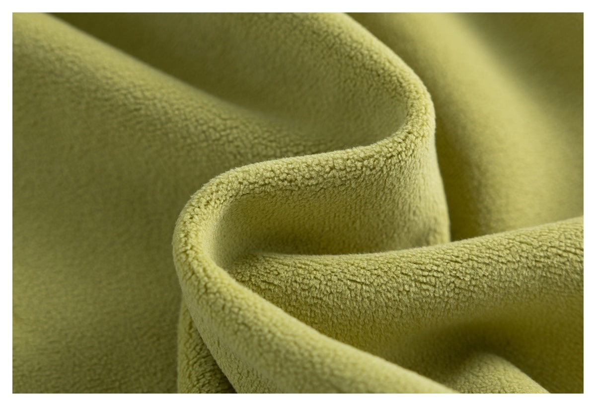 Close-up of olive-green fabric folded to show its soft, nubby surface texture.