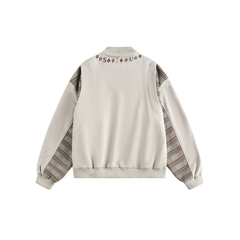 Isolated back view of a cream jacket with patterned sleeve panels, ribbed cuffs and hem, and small embroidered collar