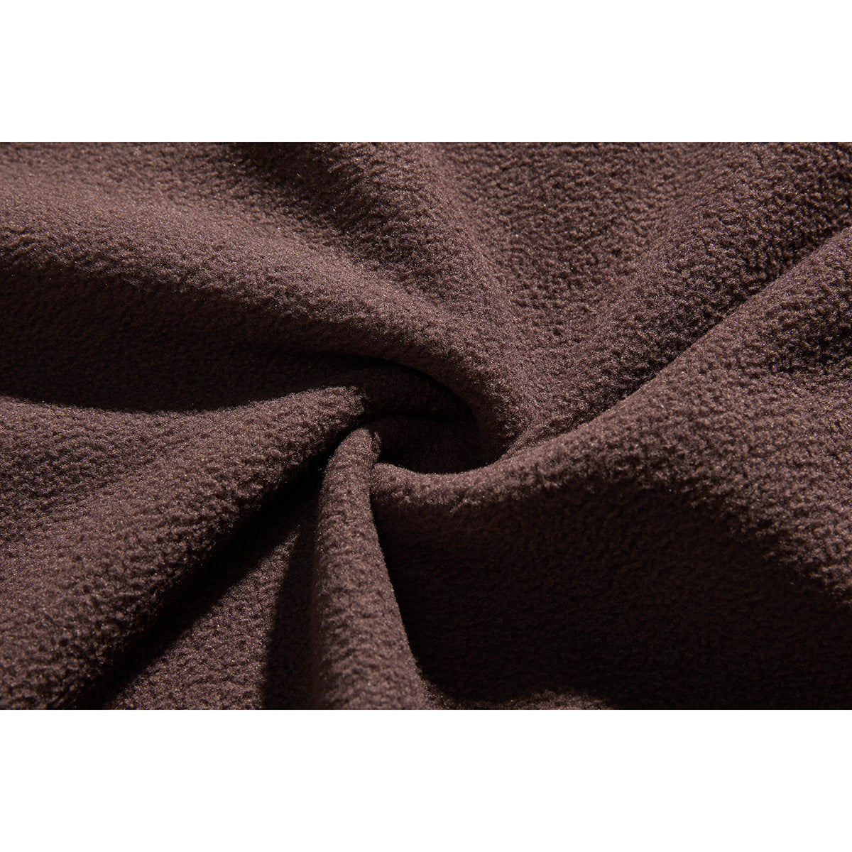 Close-up showing the nubby surface and folds of dark brown fleece fabric.