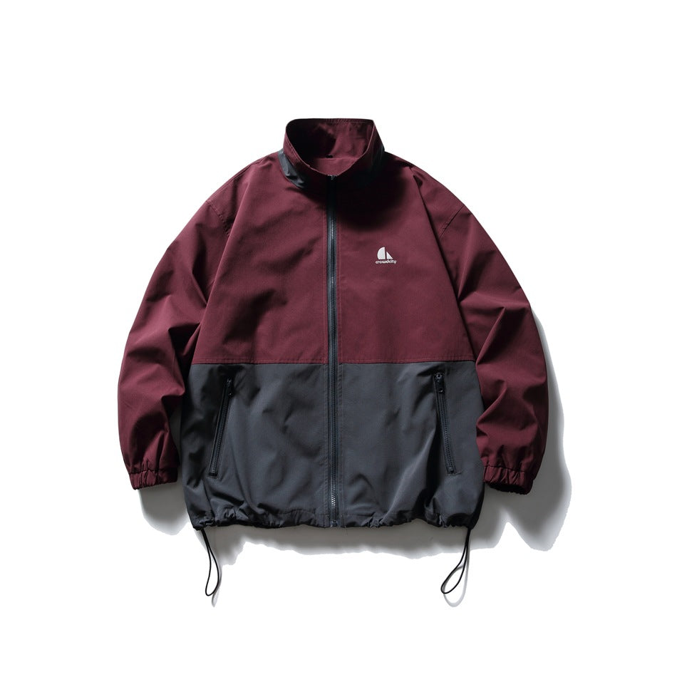 Burgundy and charcoal gray color-block stand-collar zip jacket, front flat view with zip pockets and drawcord hem