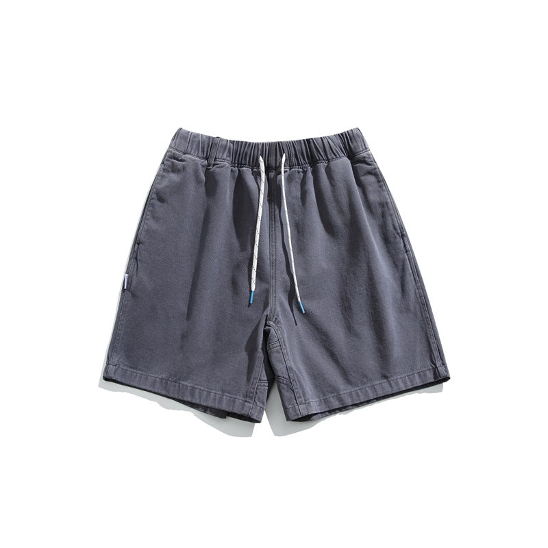 Blue-gray washed shorts with white drawstring and elastic waistband, flat lay front view