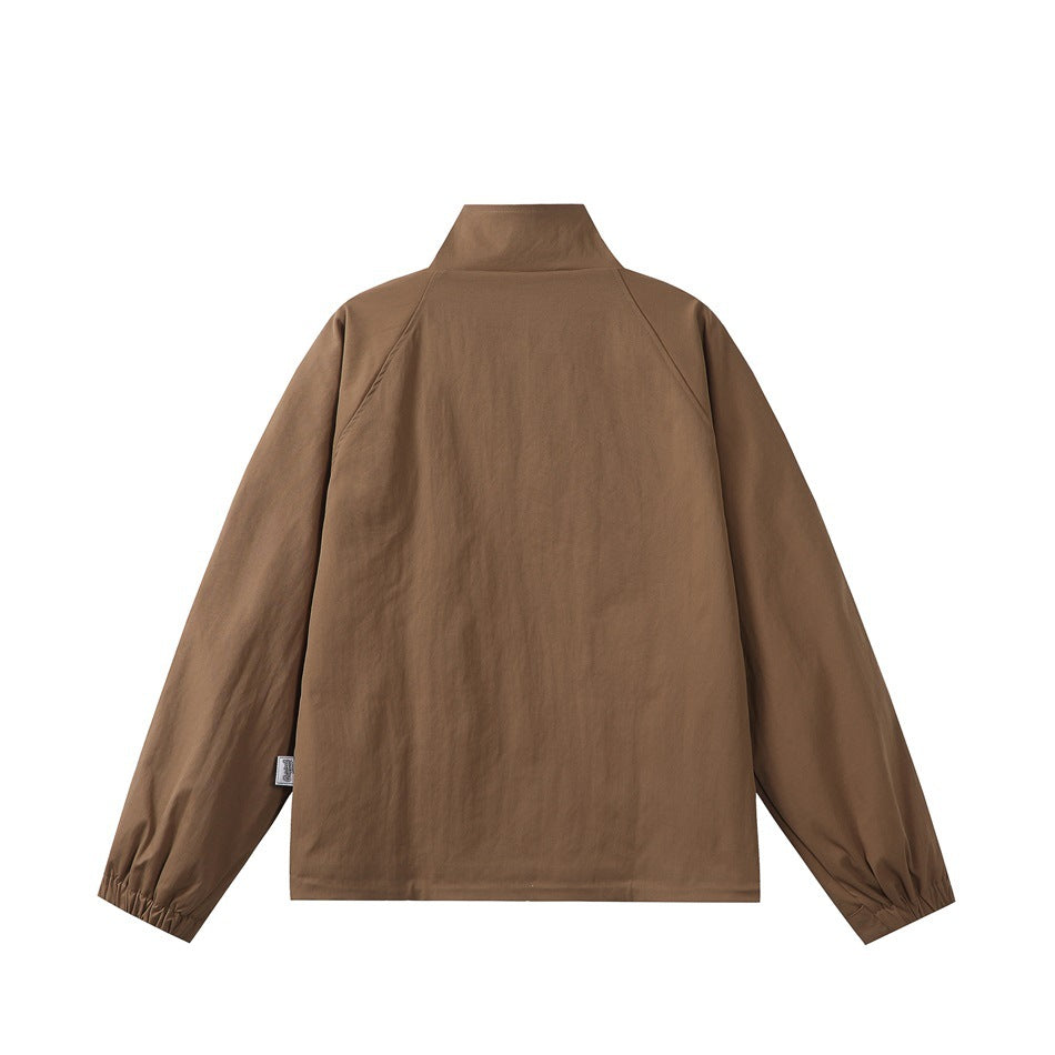 Back view of a brown stand-collar jacket with long sleeves and gathered cuffs.