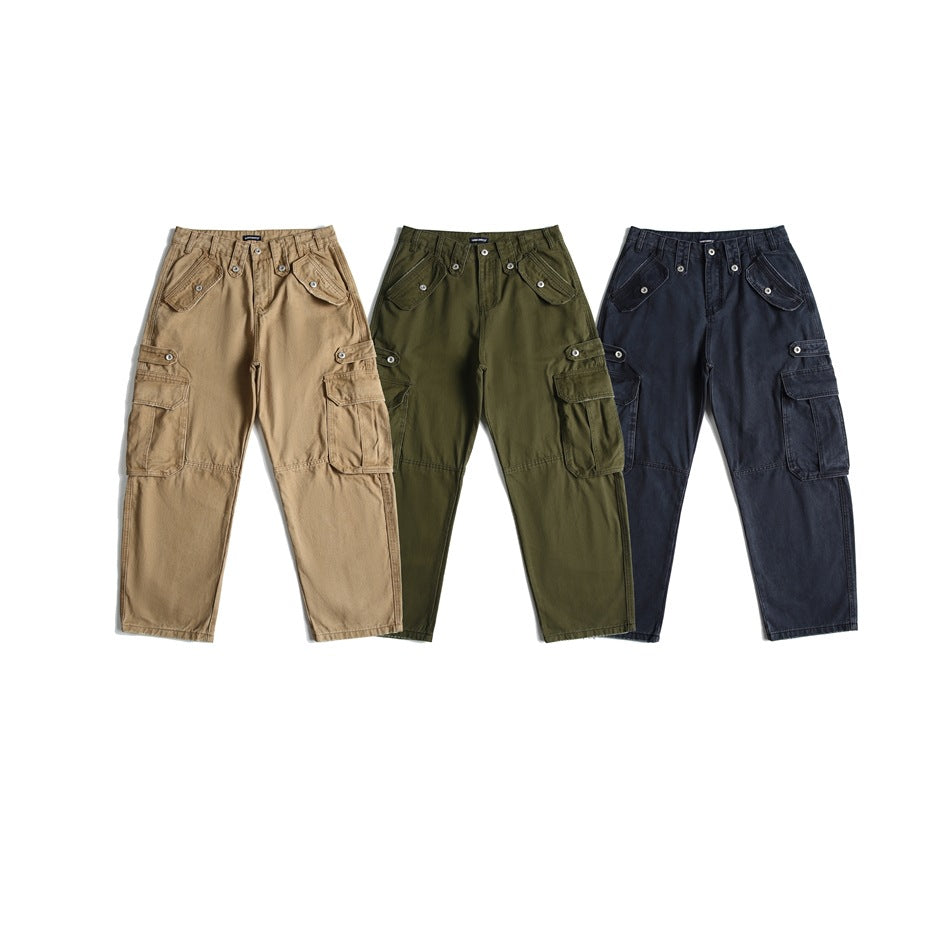 Three front views of cargo pants in tan, olive green, and dark navy, arranged side by side.