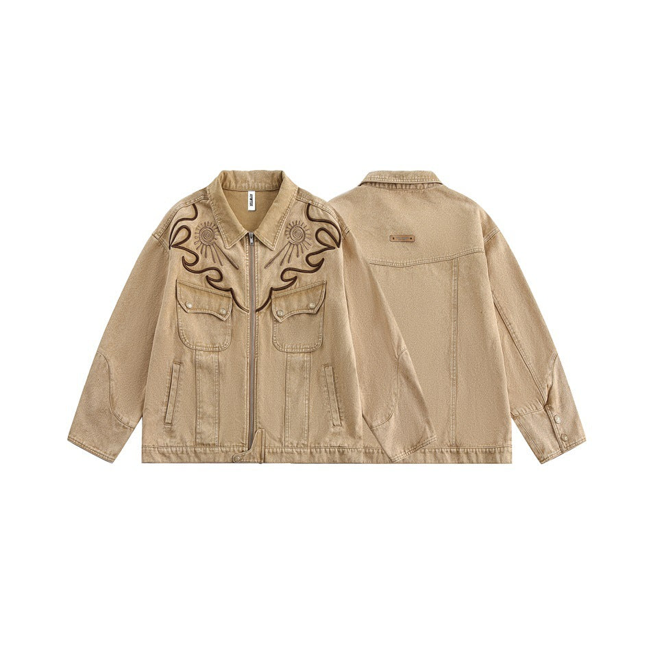 Tan jacket shown from front and back, with dark embroidered chest motifs, a zipper and multiple pockets.