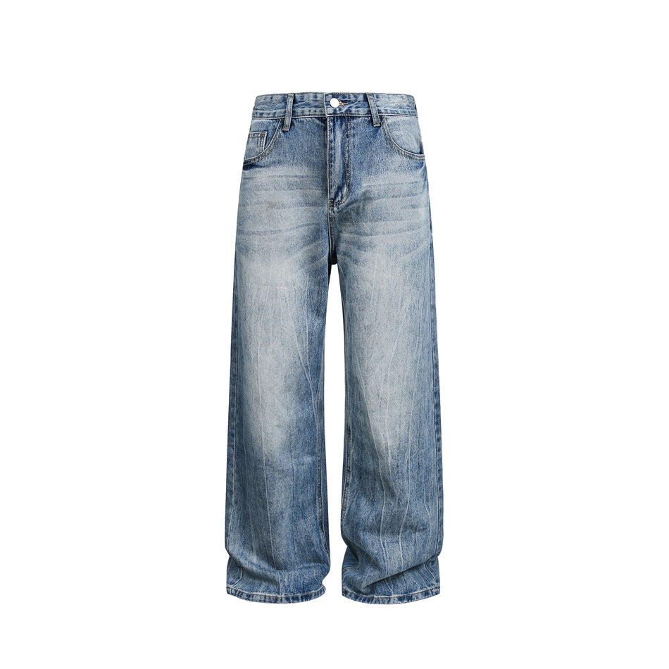 Front view of light-blue faded wide-leg jeans with whiskering, button fly and belt loops on a white background