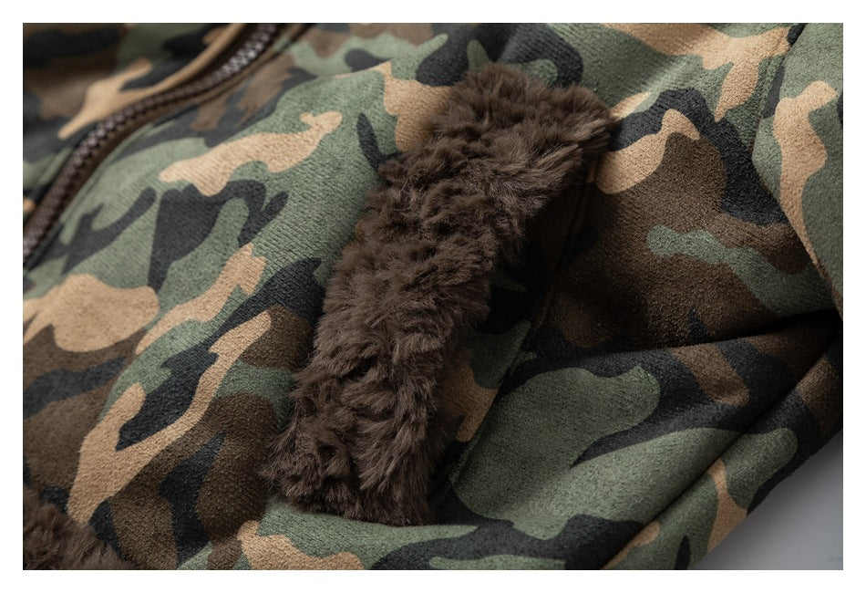 Close-up of a dark brown plush-trimmed pocket on green, tan, and black camouflage fabric.