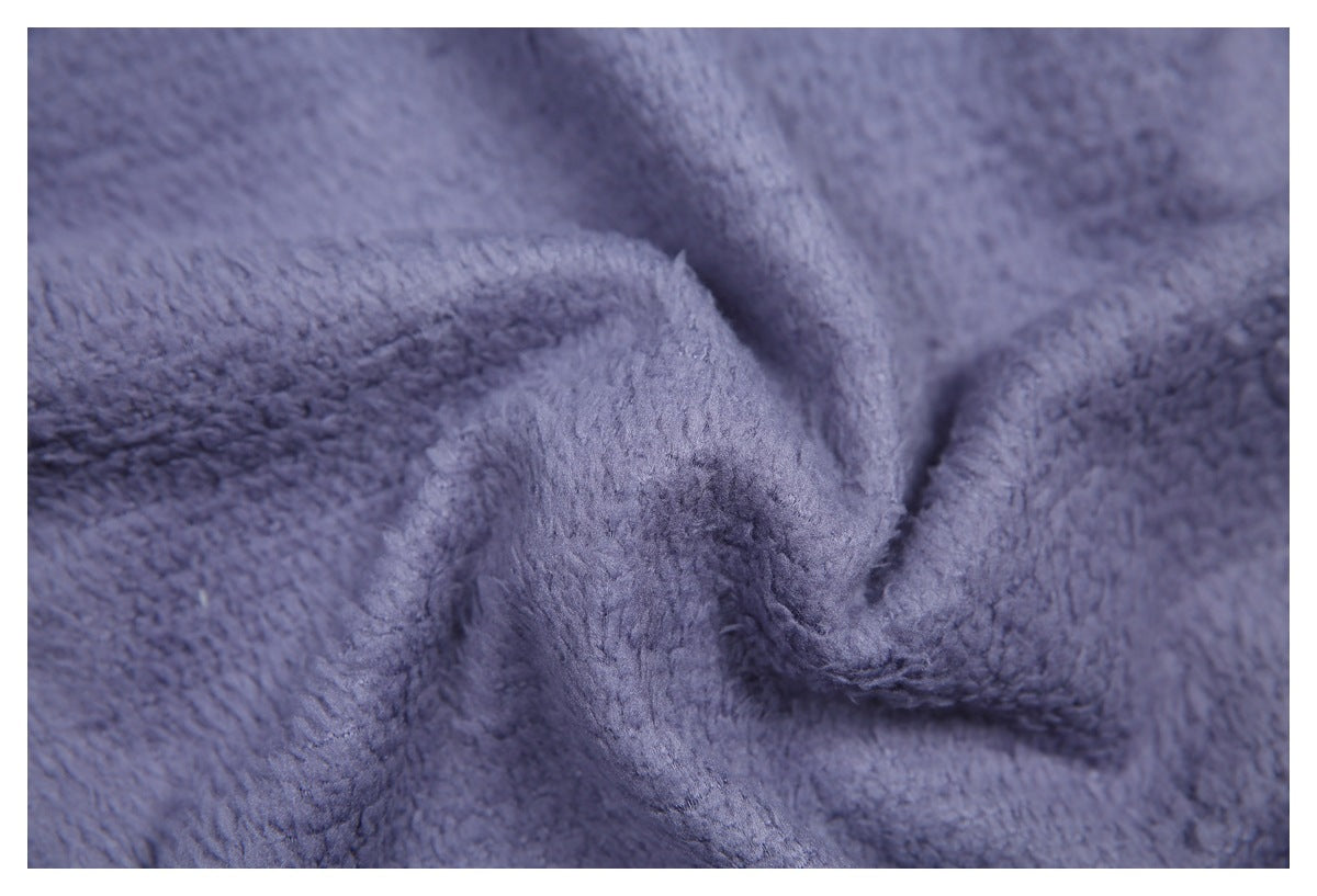 Macro view of the garment's plush blue-gray textured fabric.