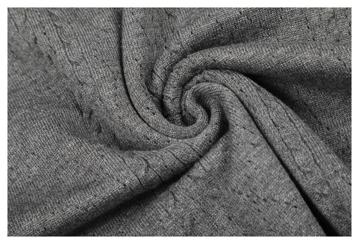 Close-up of dark gray knit fabric gathered into soft folds.