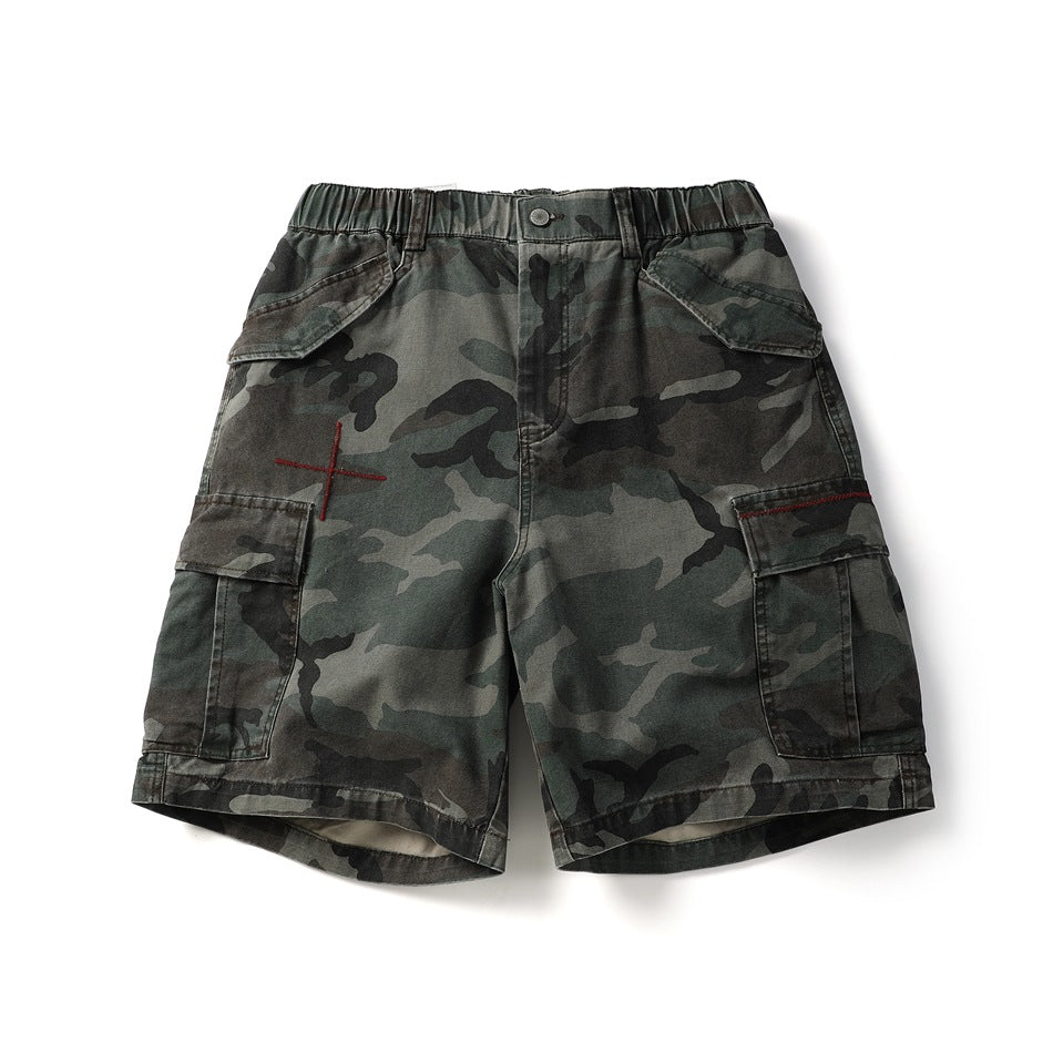 Coffee camouflage cargo shorts in a washed dark olive pattern, front flat lay, with red cross embroidery