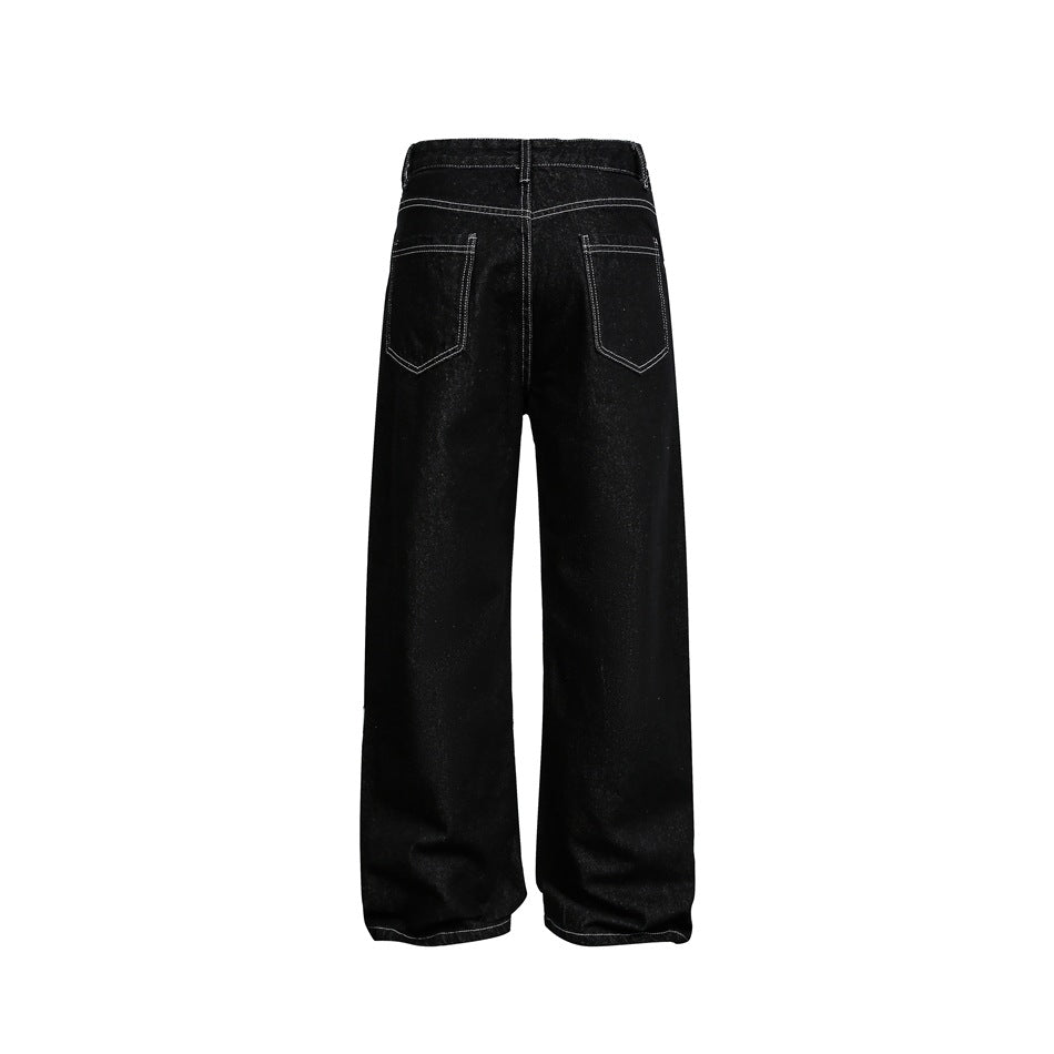 Back view of black wide-leg jeans on a white background, showing two contrast-stitched pockets.