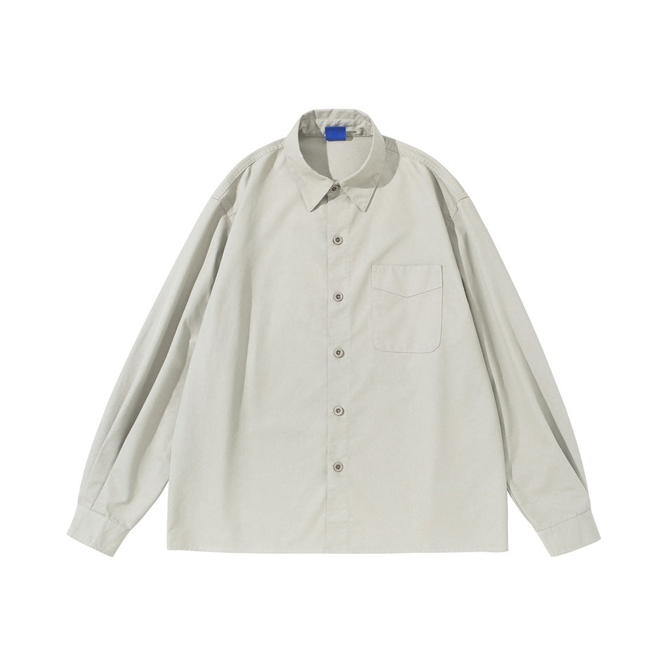 Light beige long-sleeve button-up shirt with chest pocket and blue collar tag, flat lay front view