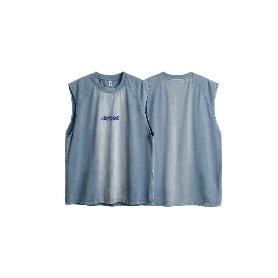 Flat product display showing the slate-blue sleeveless top from the front and back; blue script embroidery is on the chest.